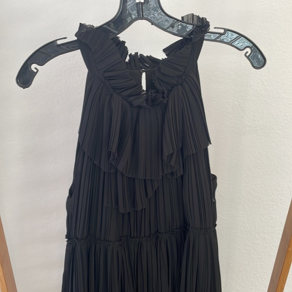 Ellie Tahari. Size S. Long black gown. Pleated neckline with tiered layers